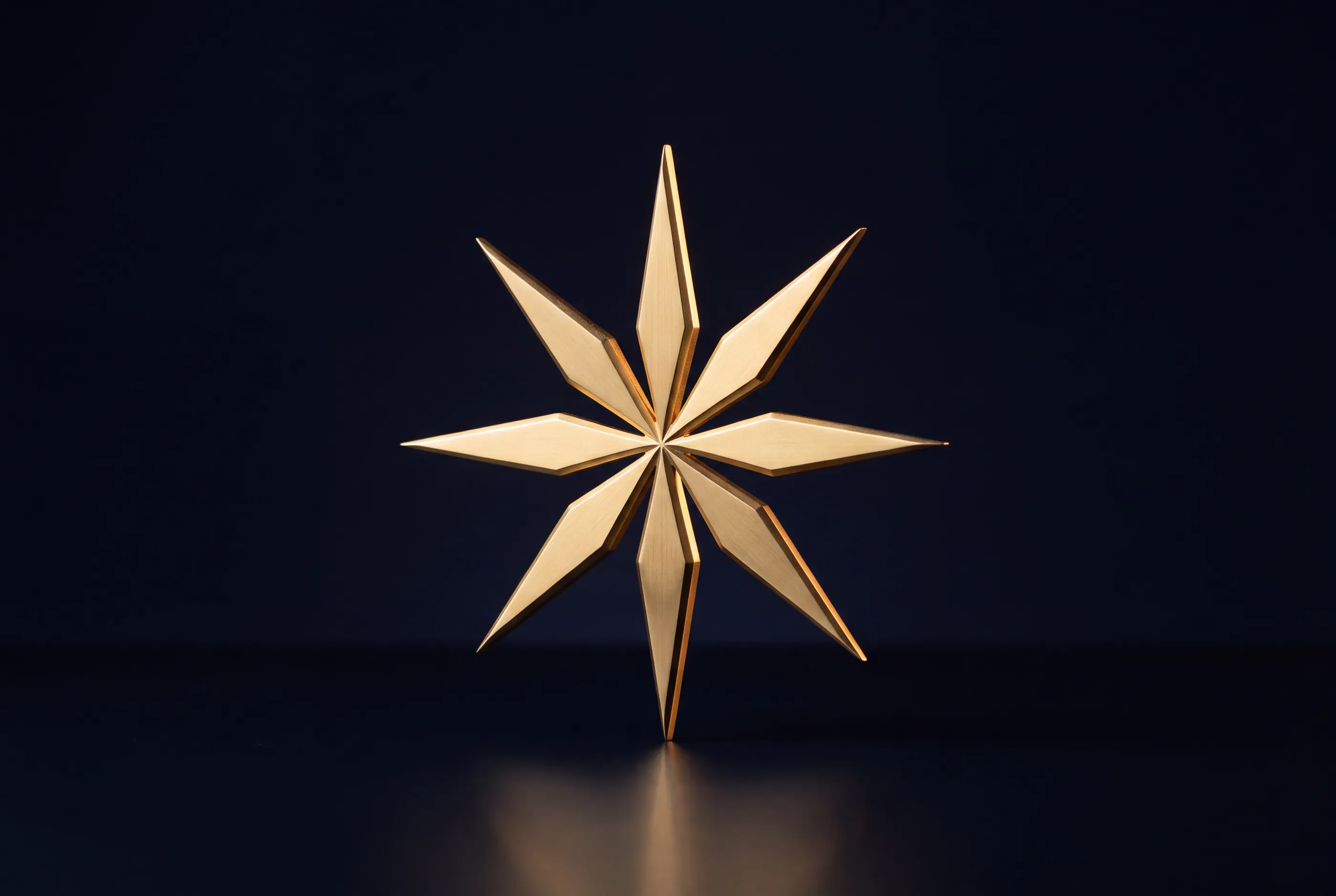 The HASORIX StarBloom, a gold eight-pointed star, as a polished sculpture